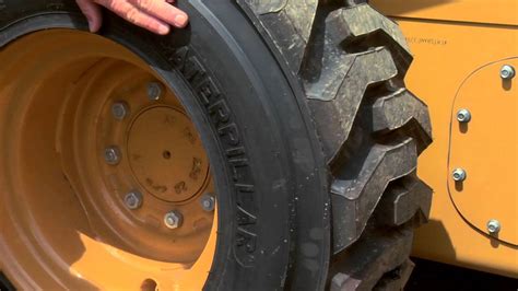 how to change flat tire on a skid steer|skid loader tire repair.